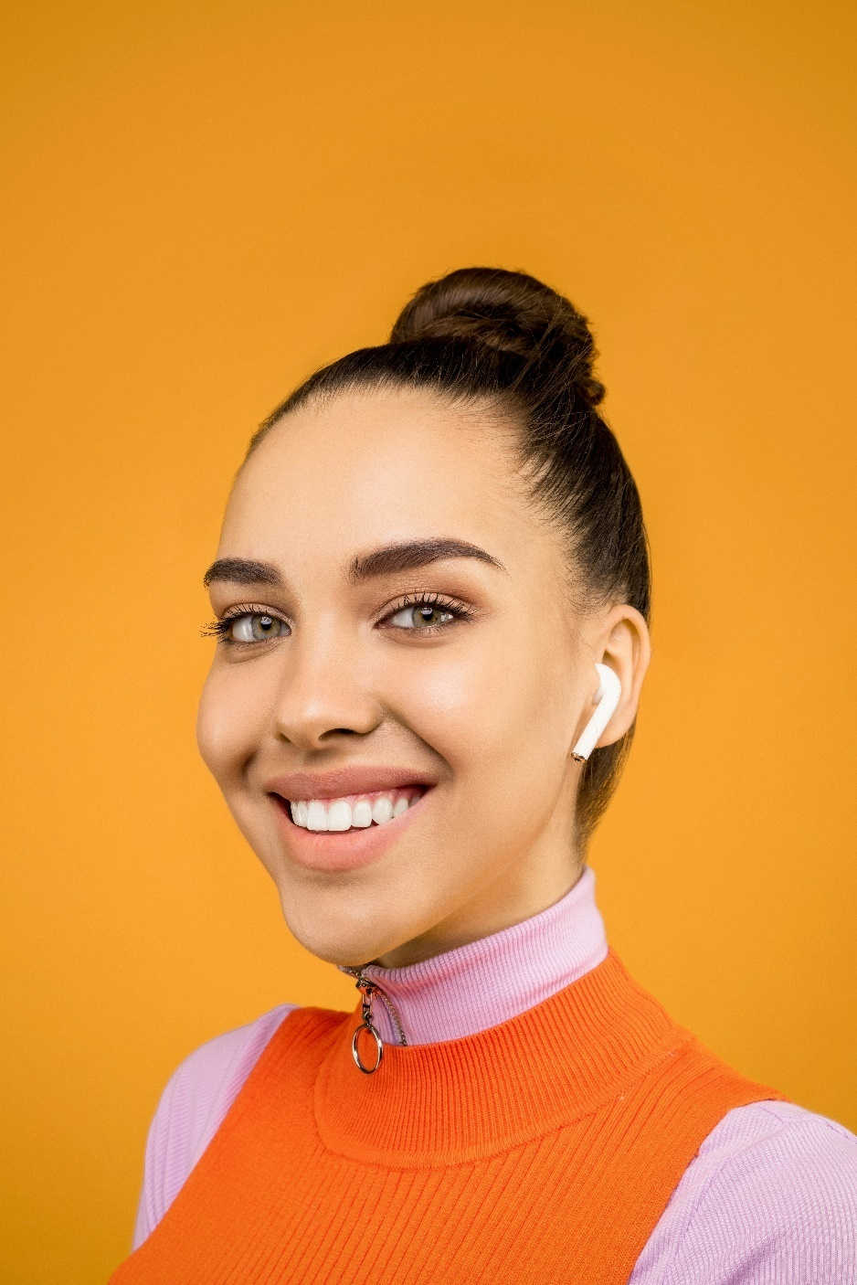 A woman smiling with her teeth showing