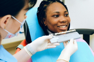 a smiling woman with a dental professiona