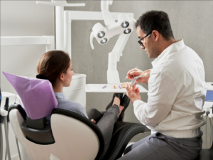 a dentist speaking with a patient