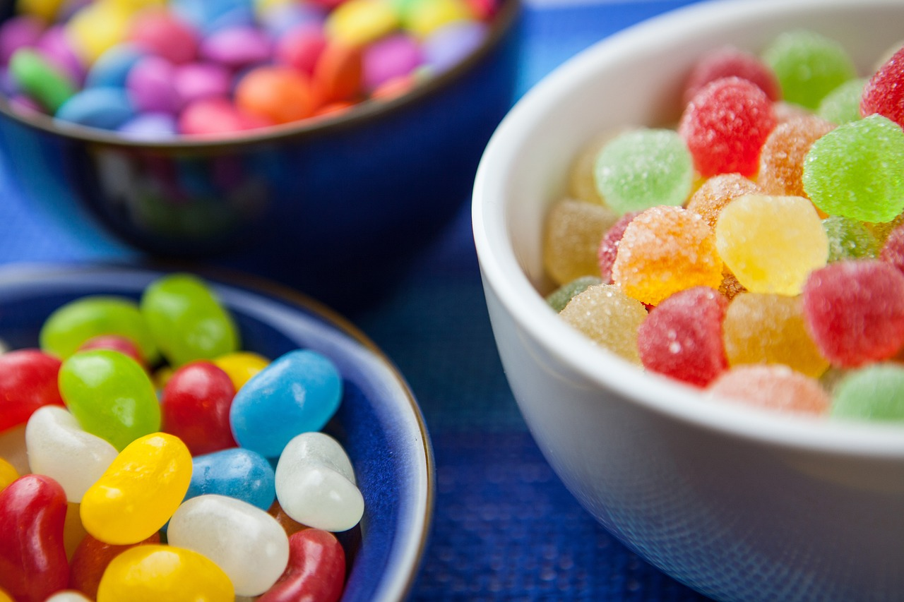 close-up shot of three small bowls filled with different candies